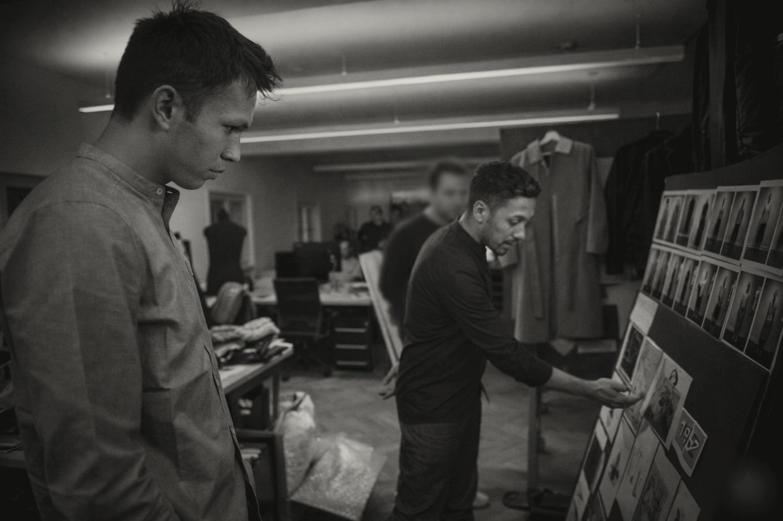 Studio review of a garment lookboard during product development.